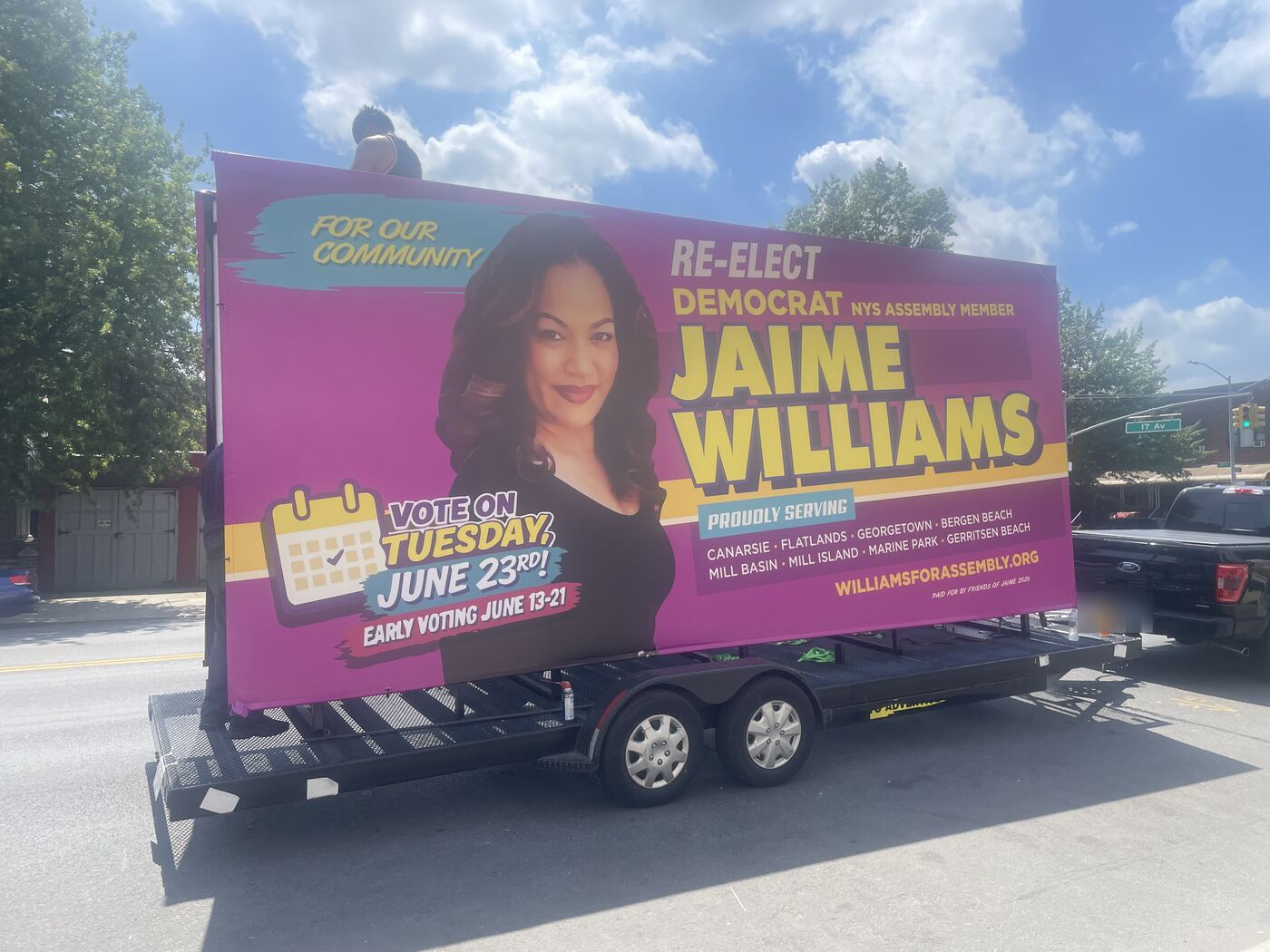 A Seen trailer with the Re-elect Jaime Williams billboard on a Brooklyn street